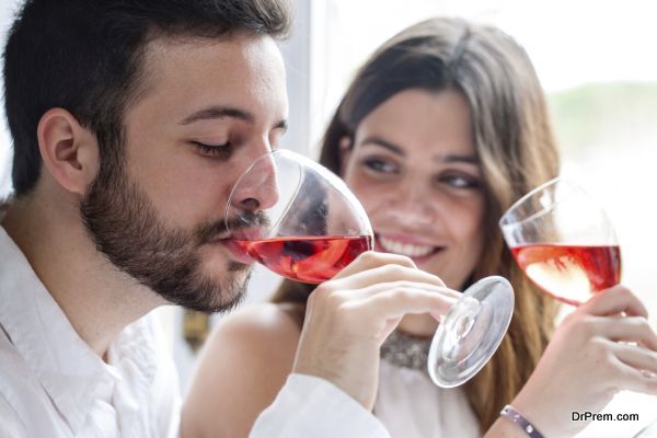 Close up portrait of Couple enjoying and drinking wine at tasting.