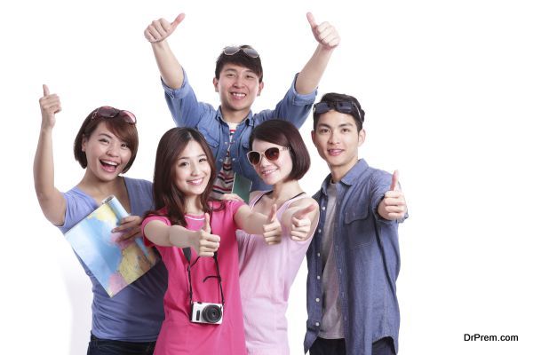 Happy group travel people hold camera, passport and map. Isolated on white background, asian